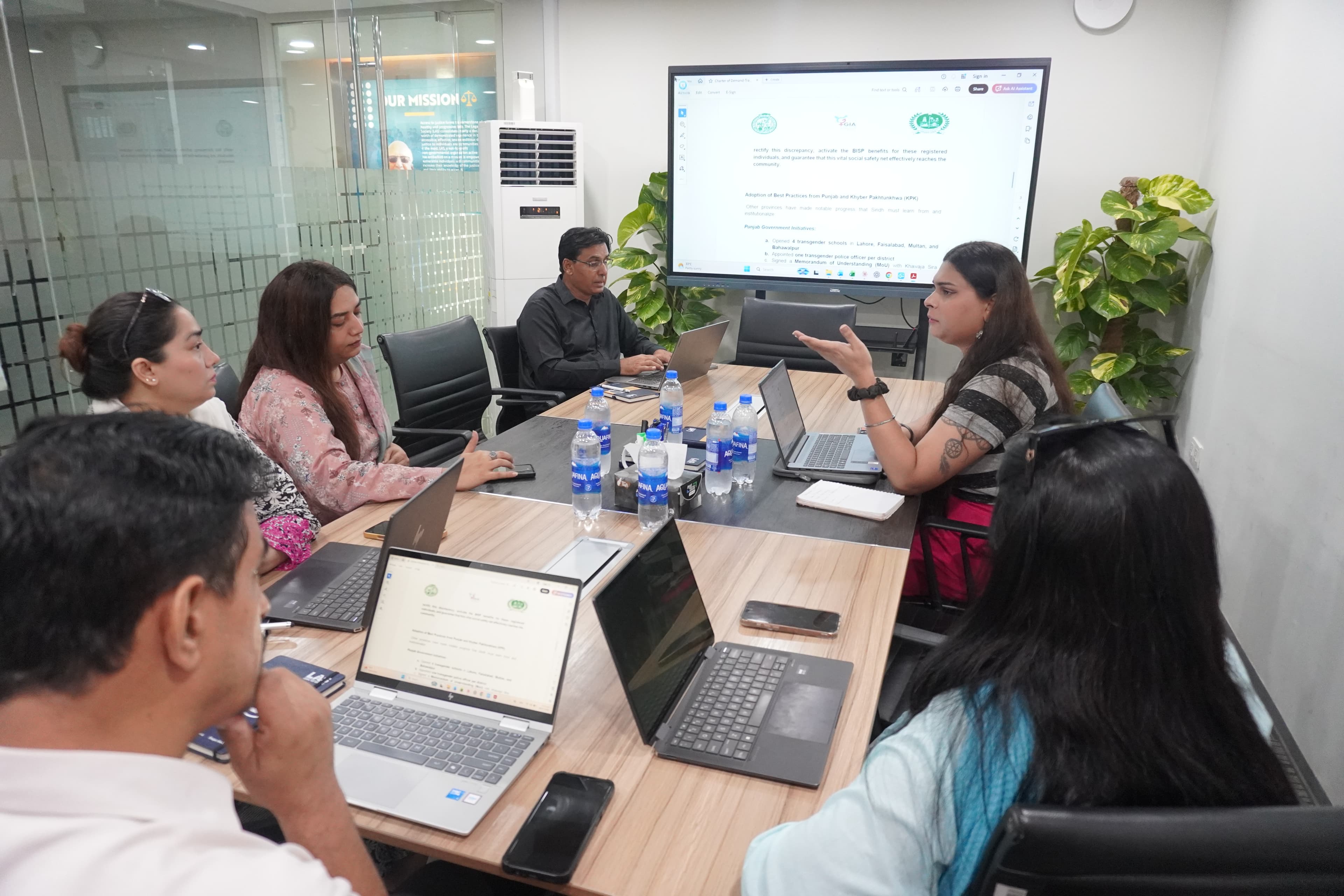 GIA team in a strategy meeting around a conference table